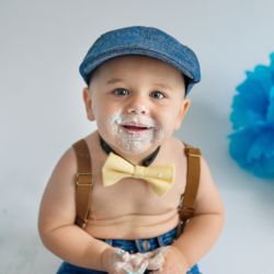 little boy in hat for cake smash photography